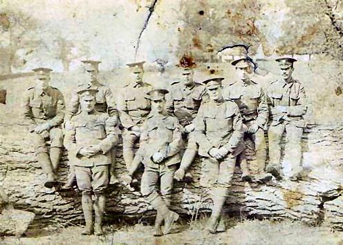 Peter Pieraccini 2nd from rightsitting on log. Bedfordshire Regiment